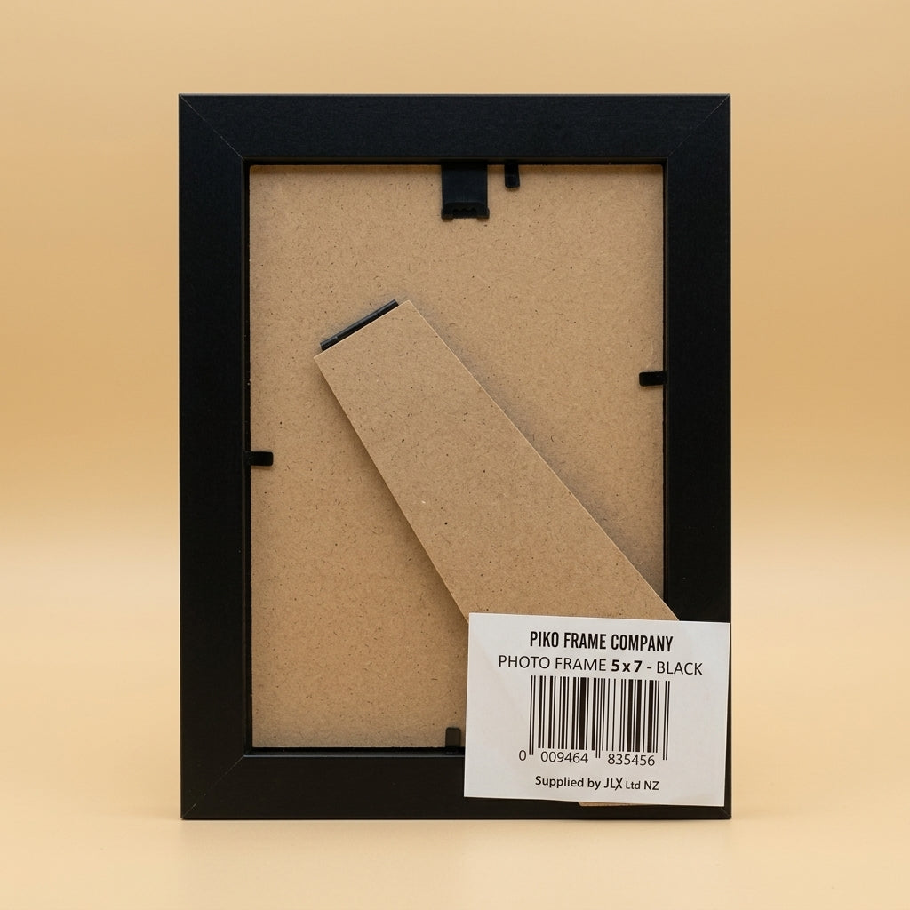 Back of black PIKO 5x7 frame showing board, easel stand and barcode label