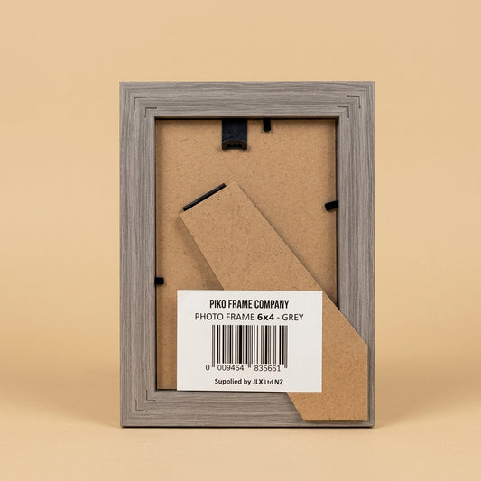 Back of grey PIKO 6x4 frame showing MDF backing board, easel stand and barcode label