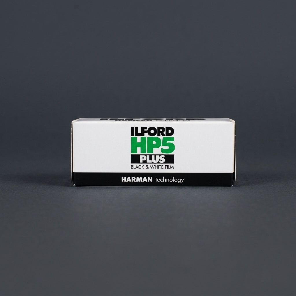 Ilford HP5 Plus 400 120 film box standing upright on dark grey background