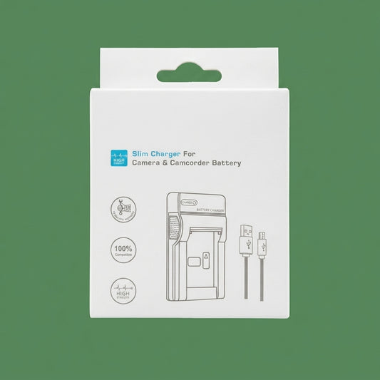 White slim camera and camcorder battery charger box on a green background