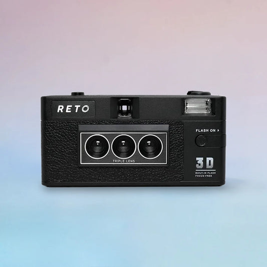 Black Reto 3D 35mm film camera with triple lens and flash, against a pastel background