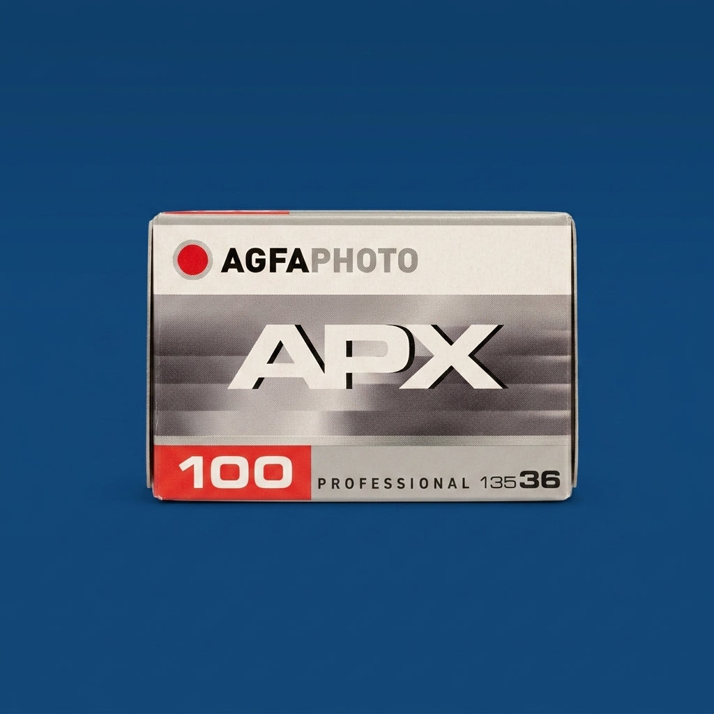 AgfaPhoto APX 100 Professional 135-36 film box on a dark blue background