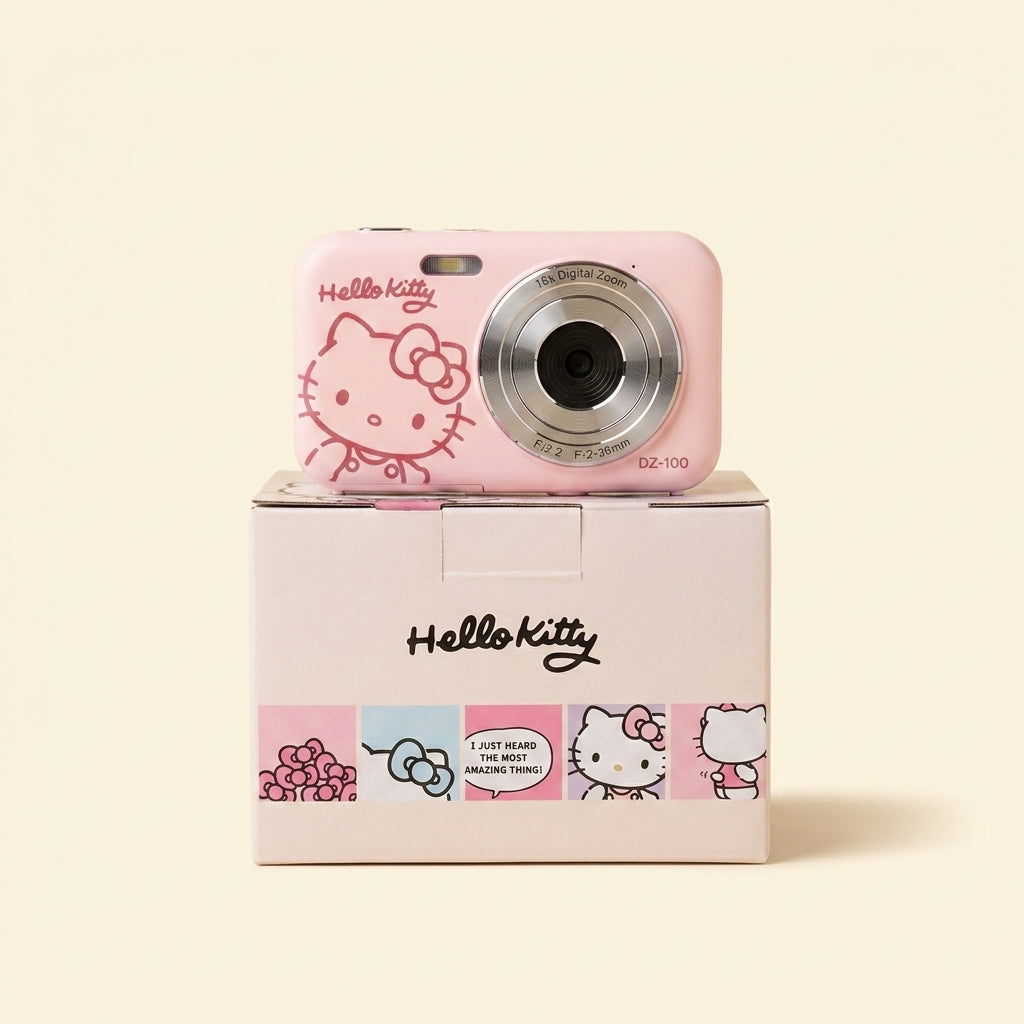 Pink Yashica Hello Kitty DZ-100 digital camera sitting on its printed box
