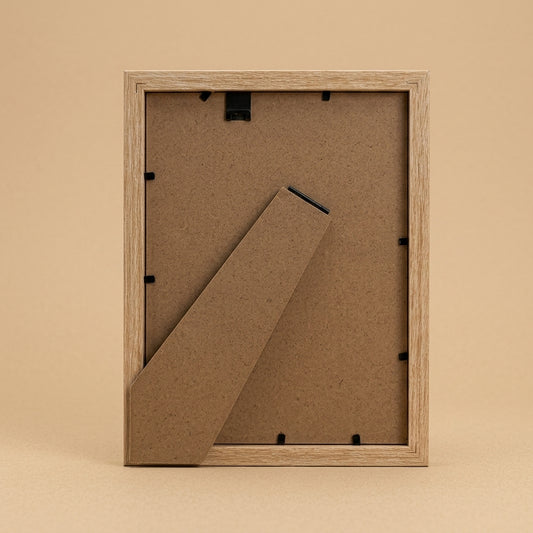 Back of oak Geneva 6x8 frame showing board, clips and fold-out stand