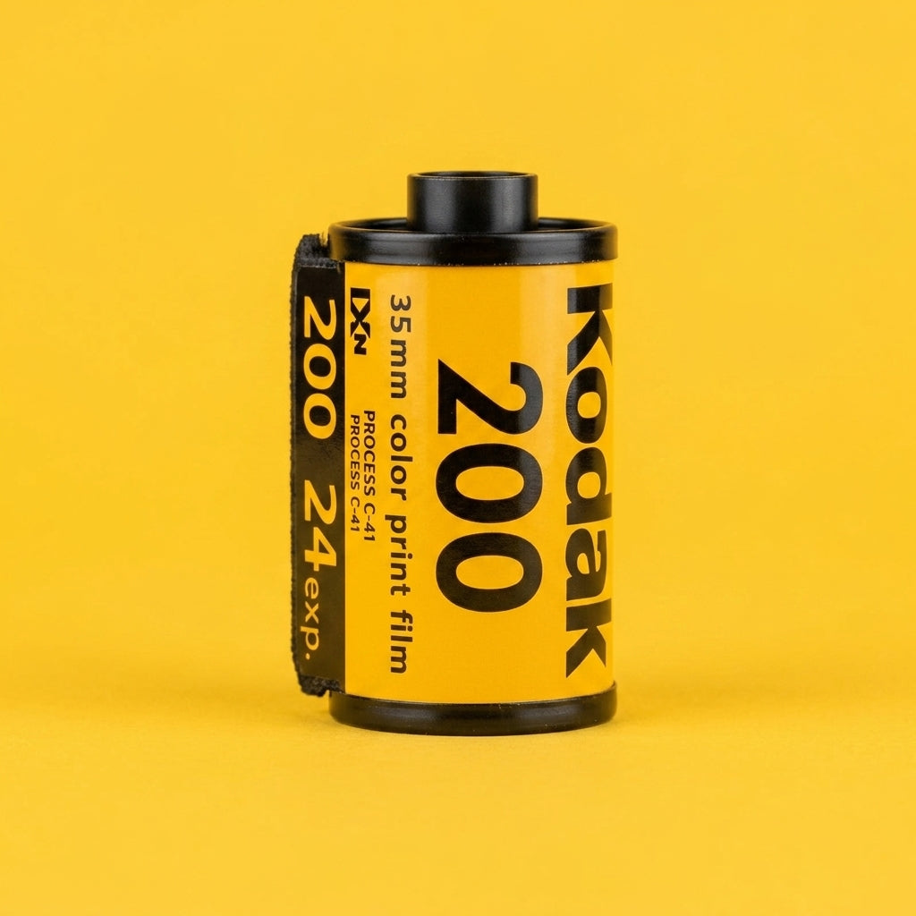 Kodak Gold 200 24exp 35mm film canister on a yellow background