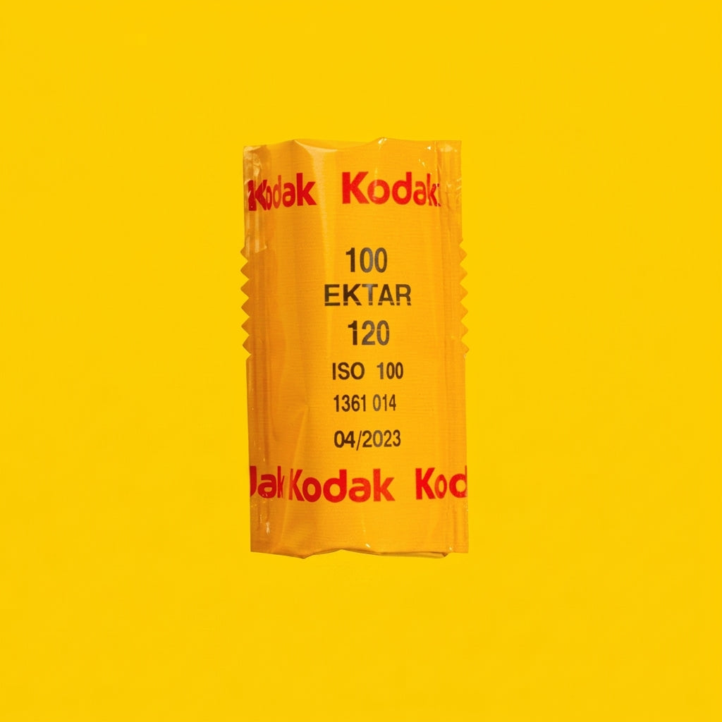 Kodak Ektar 100 120 roll in sealed foil wrapper on a yellow background