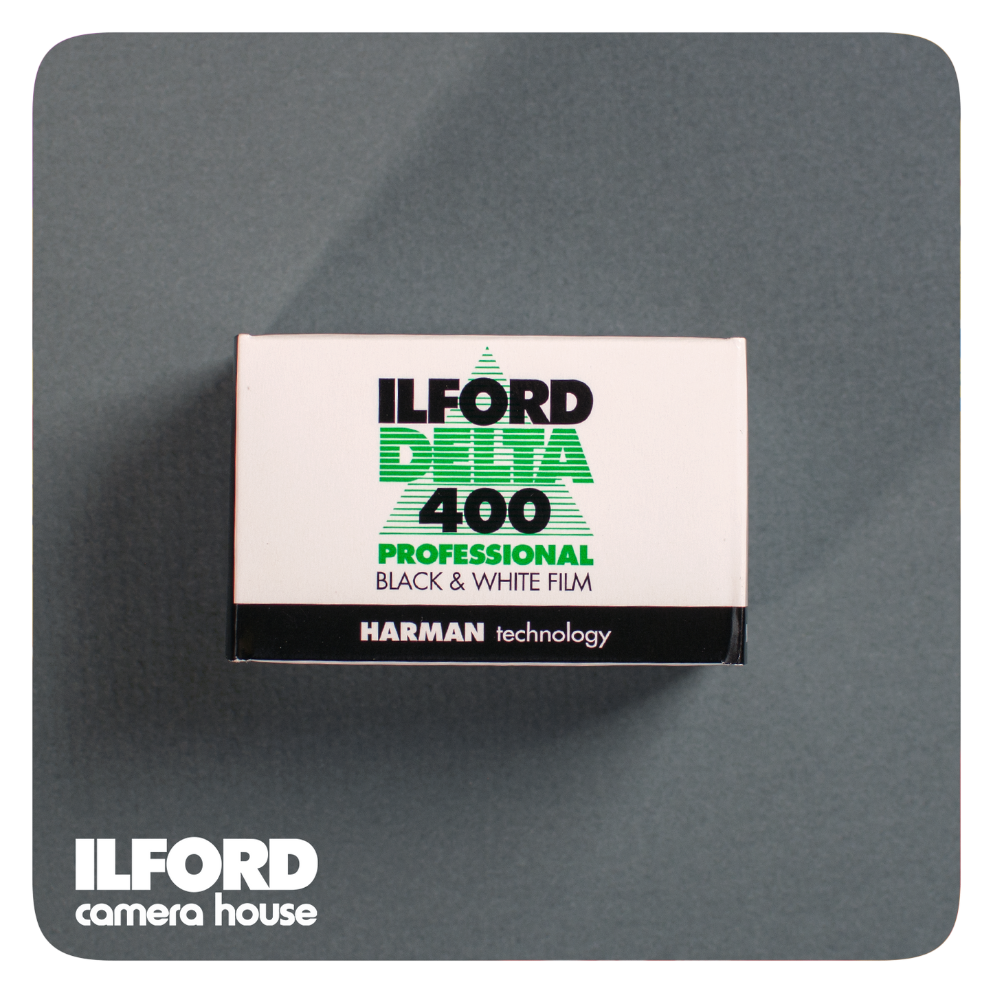 Ilford Delta 400 film box lying on a grey background with Ilford Camera House text