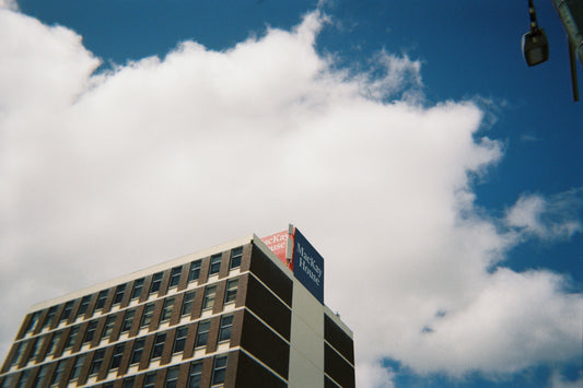 Sample shot: MacKay House building seen from below with hazy cloud