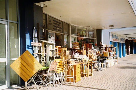 Sample shot on ColorPlus 200: second-hand furniture stacked outside a shop under a verandah