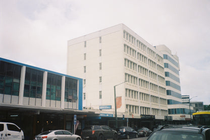 Modern building with blue accents on a cloudy day