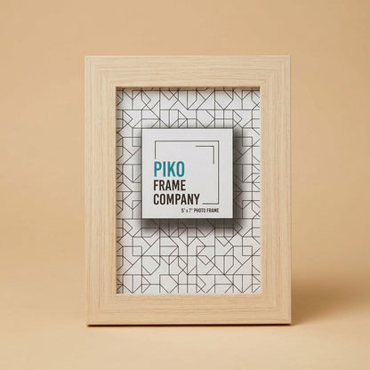 PIKO 5x7 wood photo frame standing upright on a beige background with printed insert