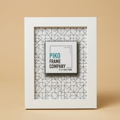PIKO 6x8 white photo frame standing upright against a beige background