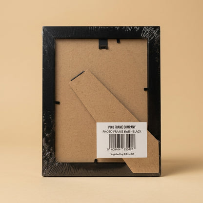 Back of the wrapped PIKO 6x8 black frame showing stand and barcode label