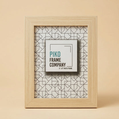 PIKO 6x8 wood photo frame standing upright on a beige background with printed insert