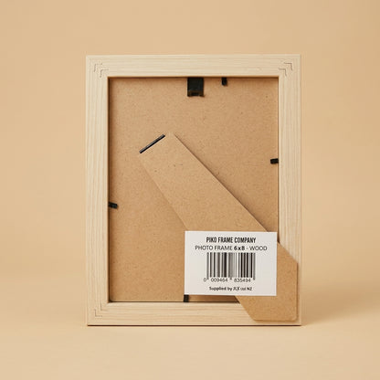 Back of the PIKO 6x8 wood frame showing stand, clips and barcode label