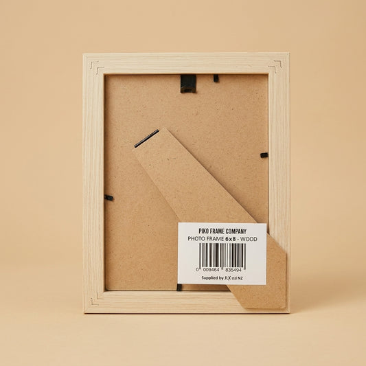 Back of the PIKO 6x8 wood frame showing stand, clips and barcode label
