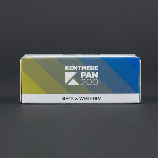 Boxed roll of Kentmere Pan 200 black and white 120 film on a dark grey background