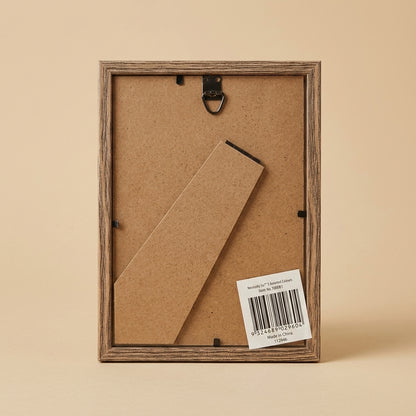 Back of the Necessity 5x7 frame showing kickstand, hanging hook and label