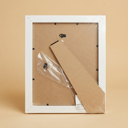 Back of the Harmony Woodland 8x10" frame in plastic wrap, showing backing board and stand