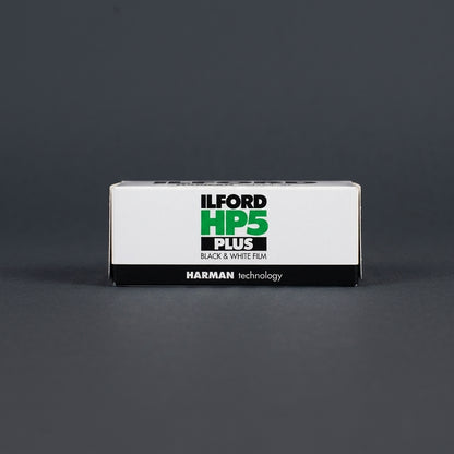 Ilford HP5 Plus 400 120 film box standing upright on dark grey background