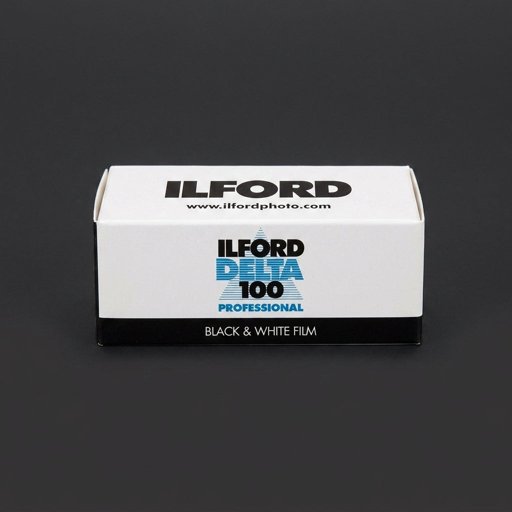 Ilford Delta 100 Professional 120 film box standing upright on dark background