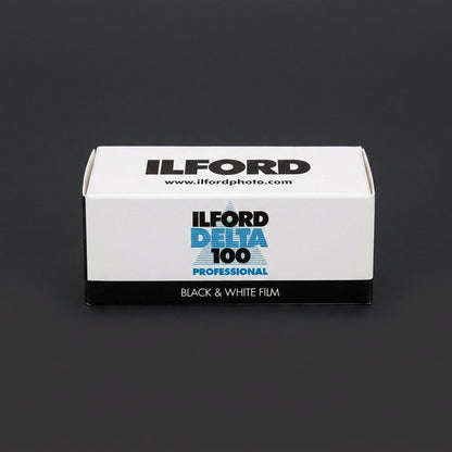 Ilford Delta 100 Professional 120 film box standing upright on dark background