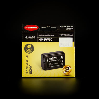 Hahnel NP-FW50 battery box with price sticker, photographed on a dark background