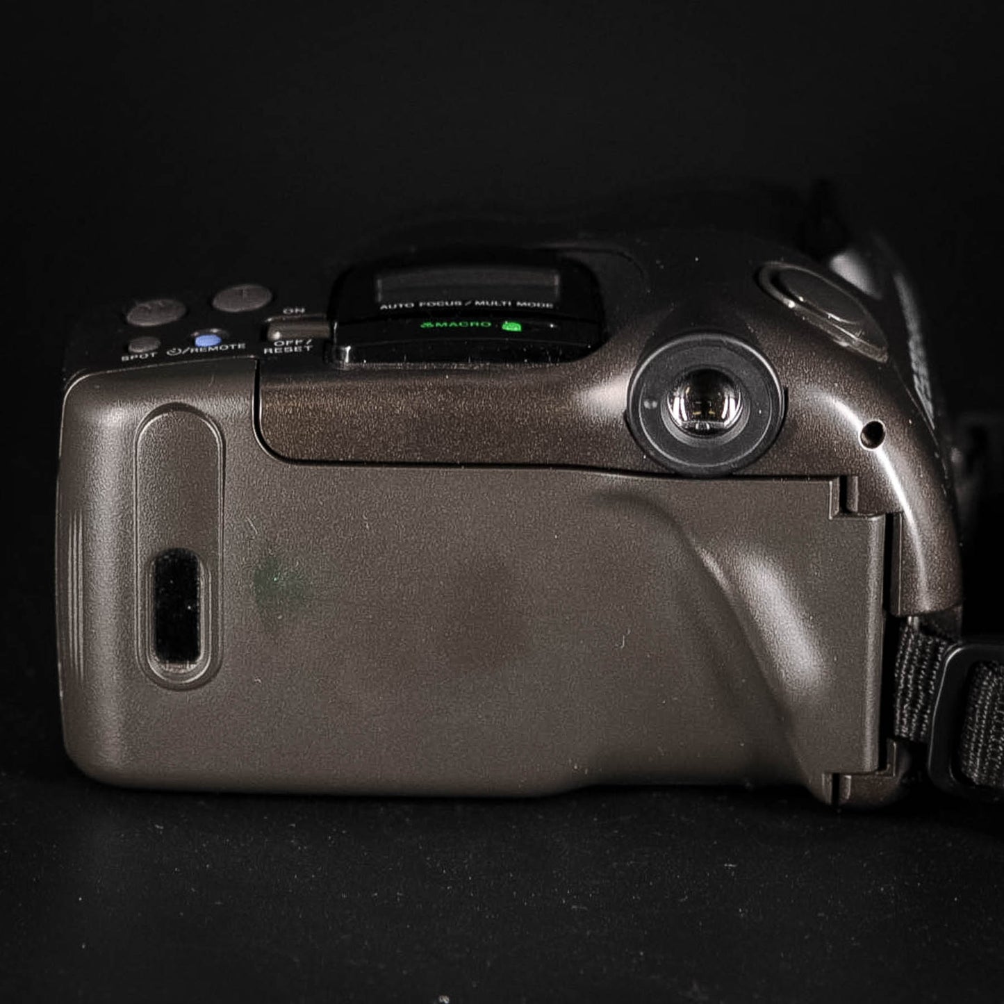 Close-up of a camera body on a black background