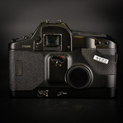 Back of the Canon EOS-1 body showing eyepiece, dial and shop sticker 8123