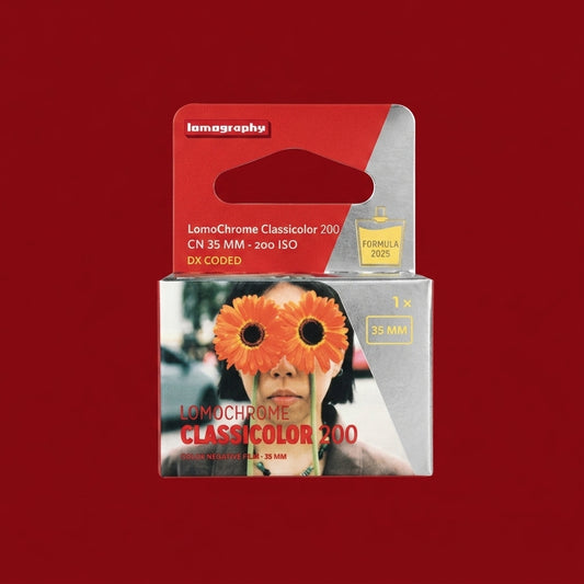 Boxed LomoChrome Classicolor 200 35mm film in red packaging on a dark red background