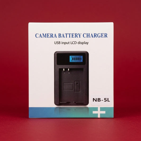 Boxed USB camera battery charger for Canon NB-5L on a dark red background