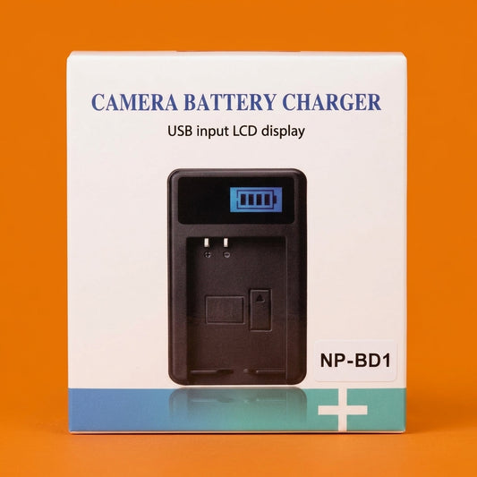 Boxed USB camera battery charger for Sony NP-BD1 on an orange background