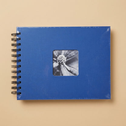 Blue spiral-bound Hama album, shrink-wrapped, with black and white flower cut-out on cover