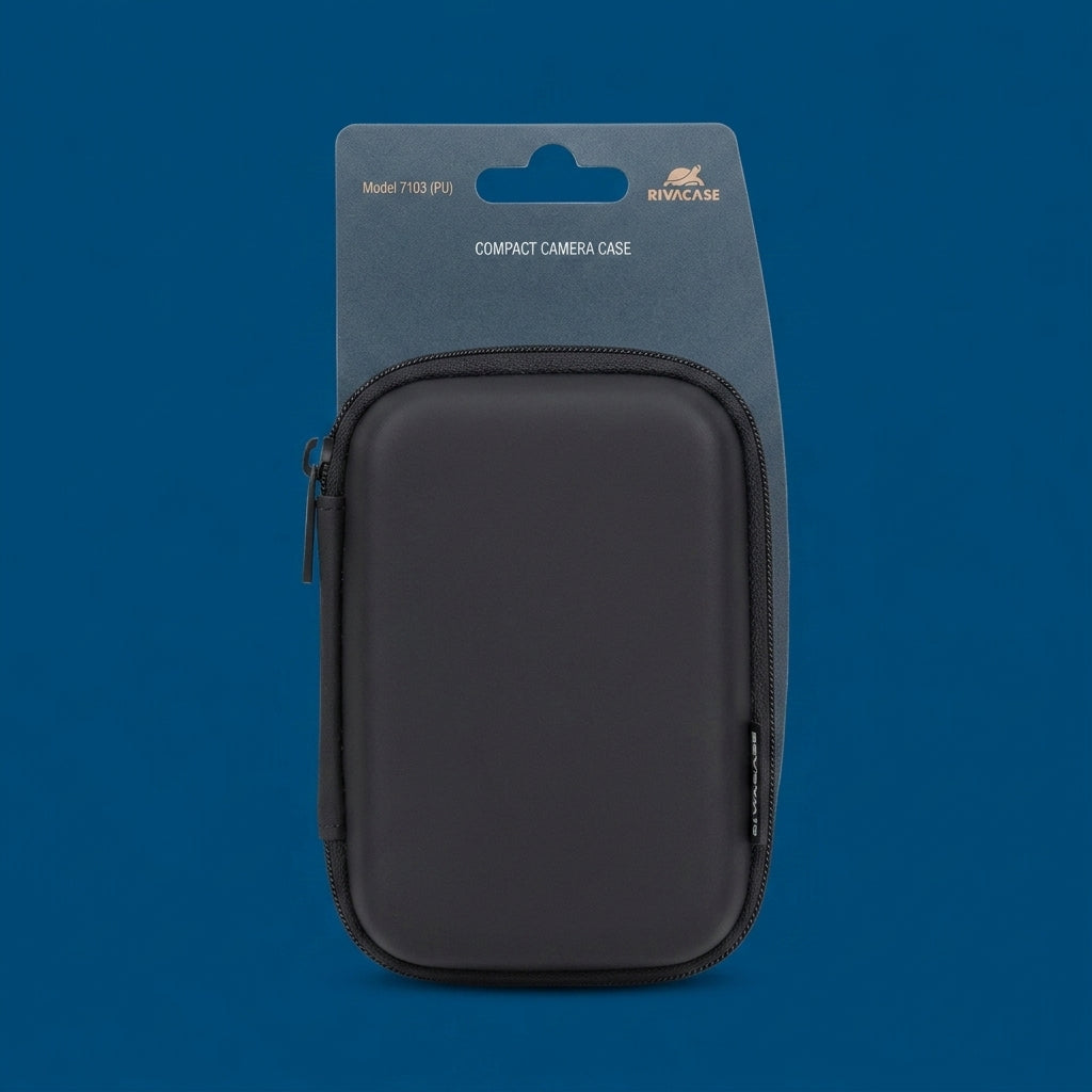 Black RivaCase 7103 compact camera hard case with zip, on backing card