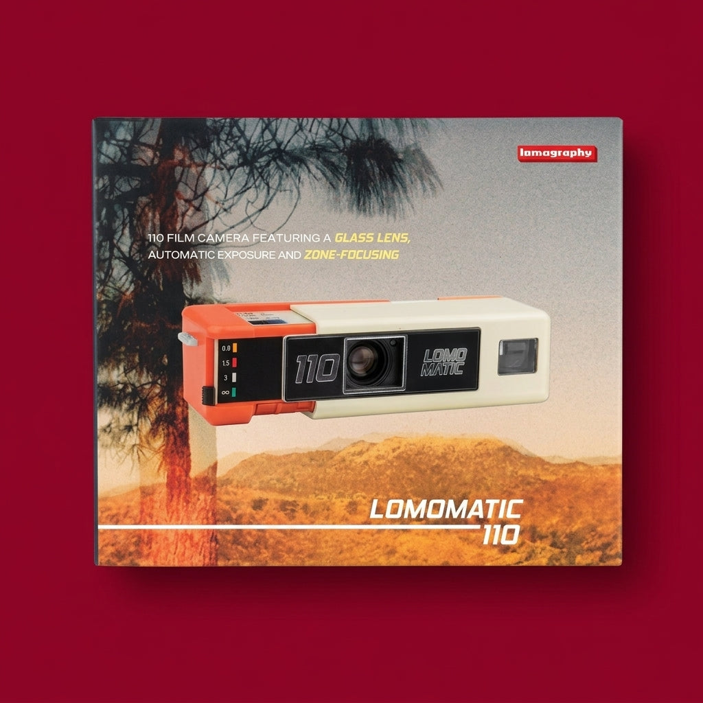 Boxed Lomography Lomomatic 110 camera, box front on a dark red background
