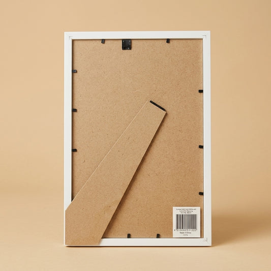 Back of white 8x12 frame with MDF backing, easel stand and label