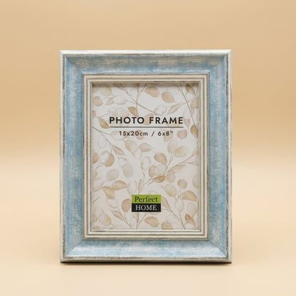 Distressed blue and white 6x8 photo frame with printed insert, upright on beige background