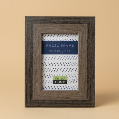 Westminster 6x4 photo frame in grey woodgrain finish, standing on a beige background