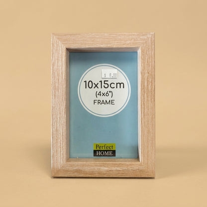 Geneva 6x4 oak photo frame standing upright on a beige background