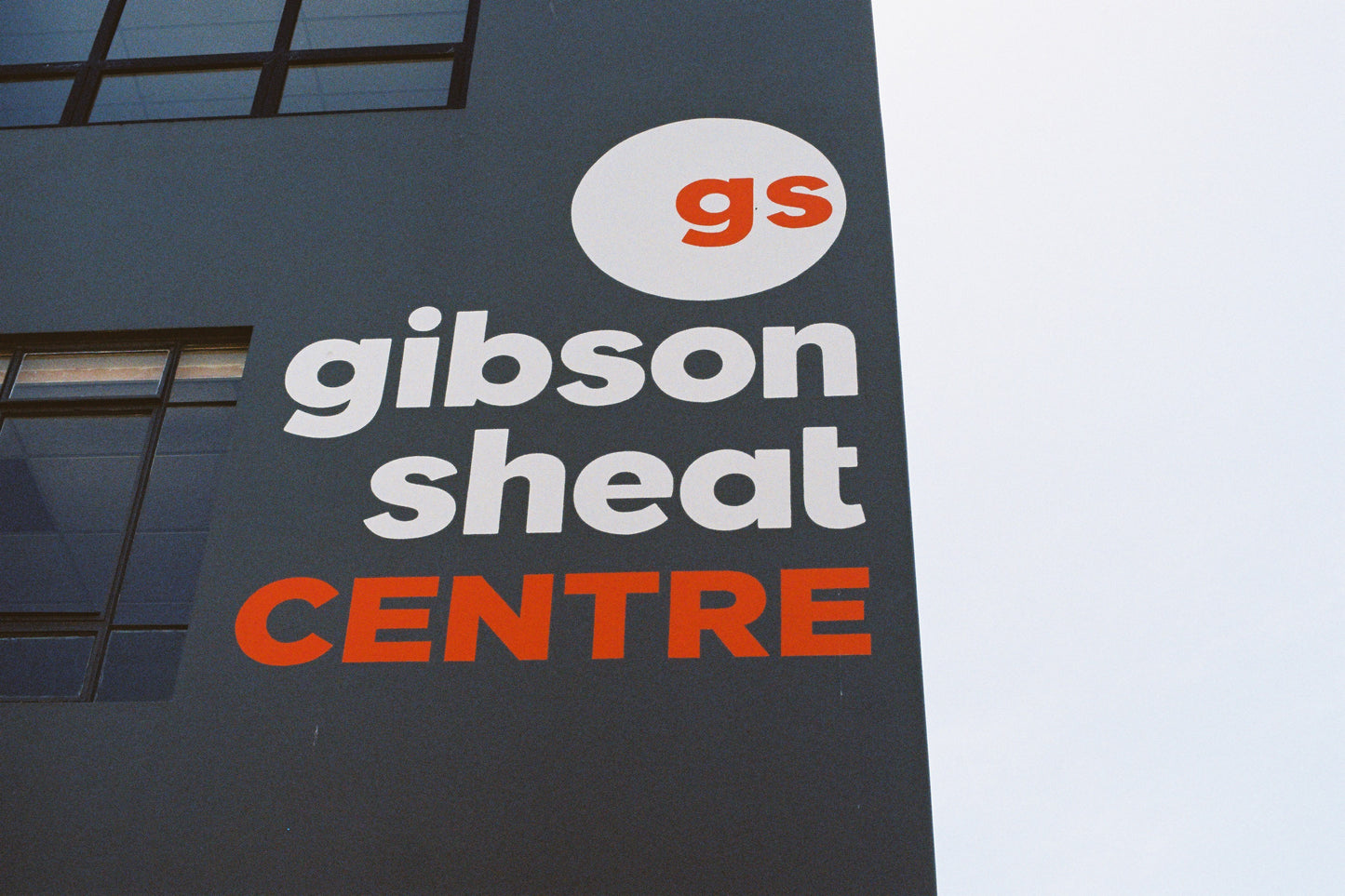 Gibson Sheat Centre sign on a building facade with 'gs' logo.