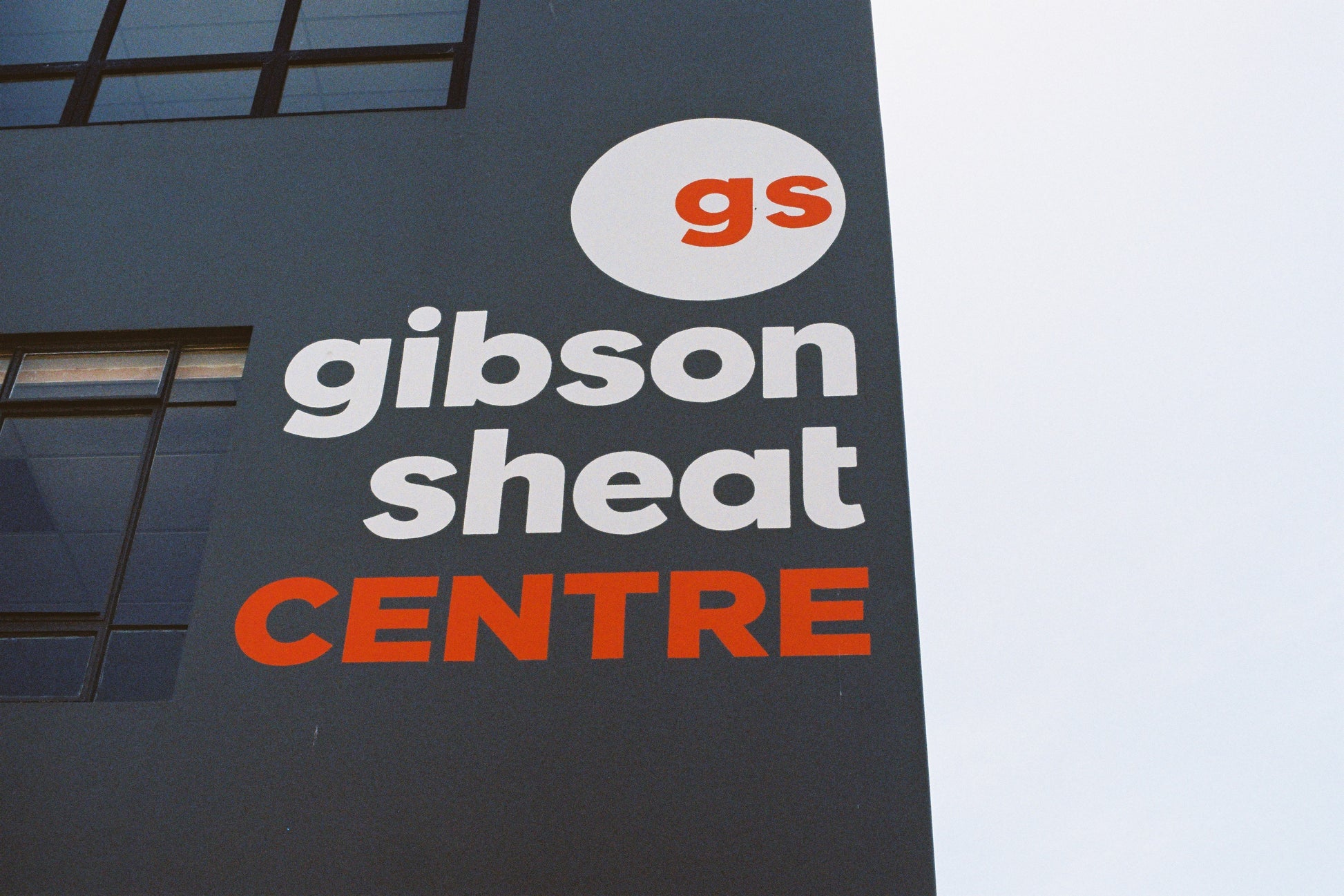 Gibson Sheat Centre sign on a building facade with 'gs' logo.