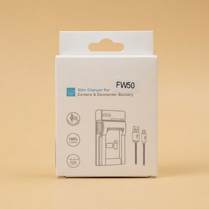FW50 slim charger in white box with label, on a pale beige background