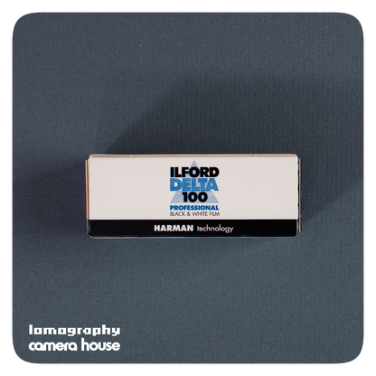 Ilford Delta 100 Professional 120 film box lying on grey-blue card